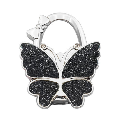 🦋Foldable Purse Hook for Table - Portable Bag Holder,Folding Handbag Hanger Various Heavy Items Desk Hook