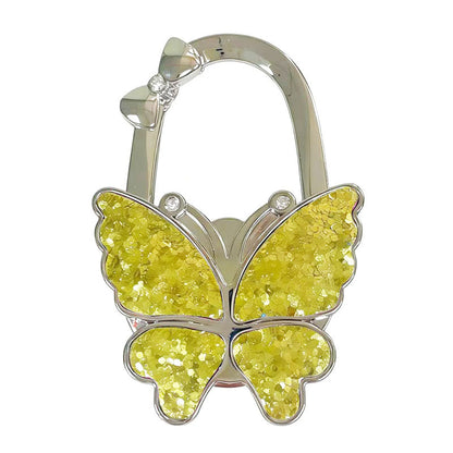 🦋Foldable Purse Hook for Table - Portable Bag Holder,Folding Handbag Hanger Various Heavy Items Desk Hook