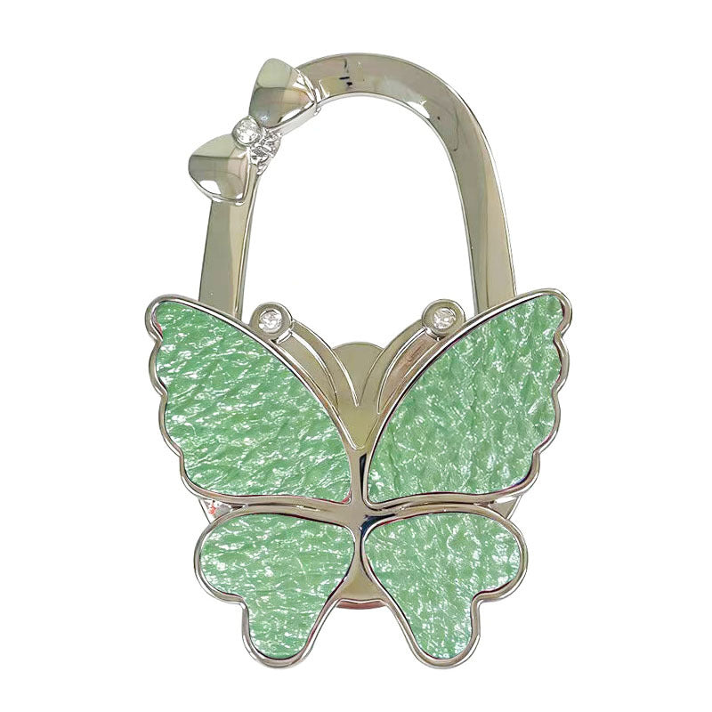 🦋Foldable Purse Hook for Table - Portable Bag Holder,Folding Handbag Hanger Various Heavy Items Desk Hook
