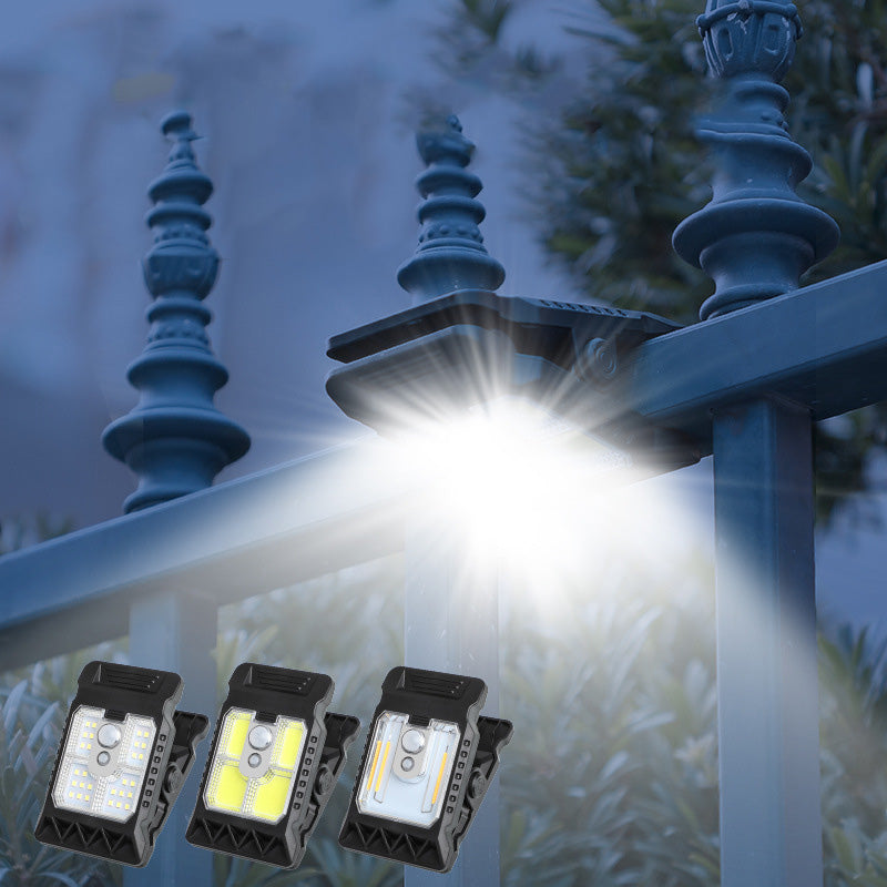Outdoor solar-powered light with clip and motion sensor