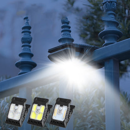 Outdoor solar-powered light with clip and motion sensor
