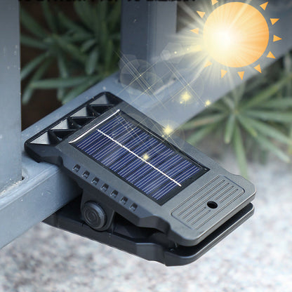 Outdoor solar-powered light with clip and motion sensor