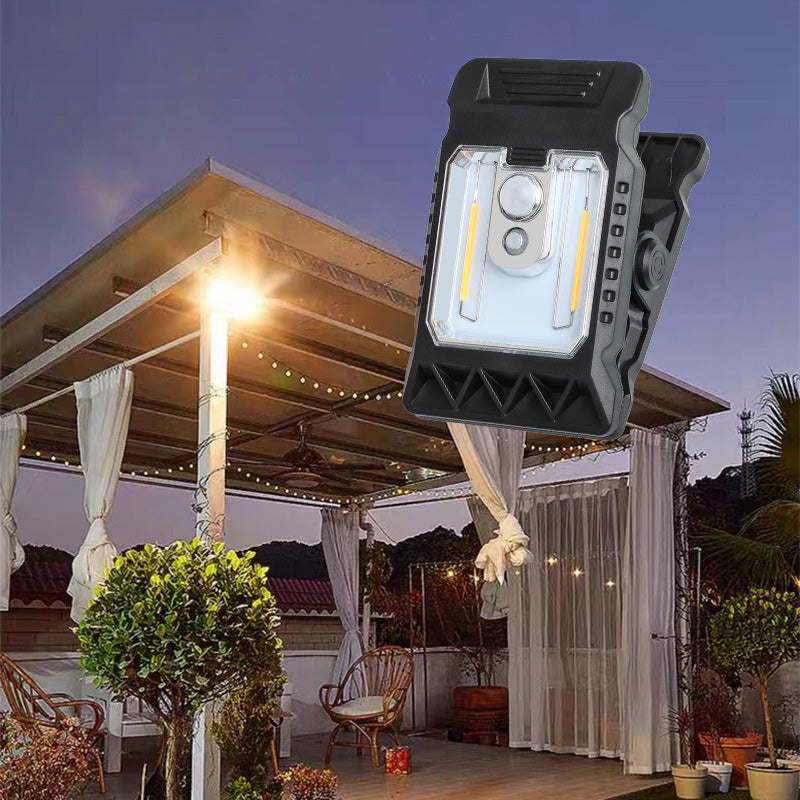 Outdoor solar-powered light with clip and motion sensor