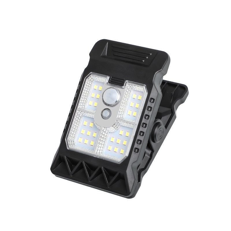 Outdoor solar-powered light with clip and motion sensor