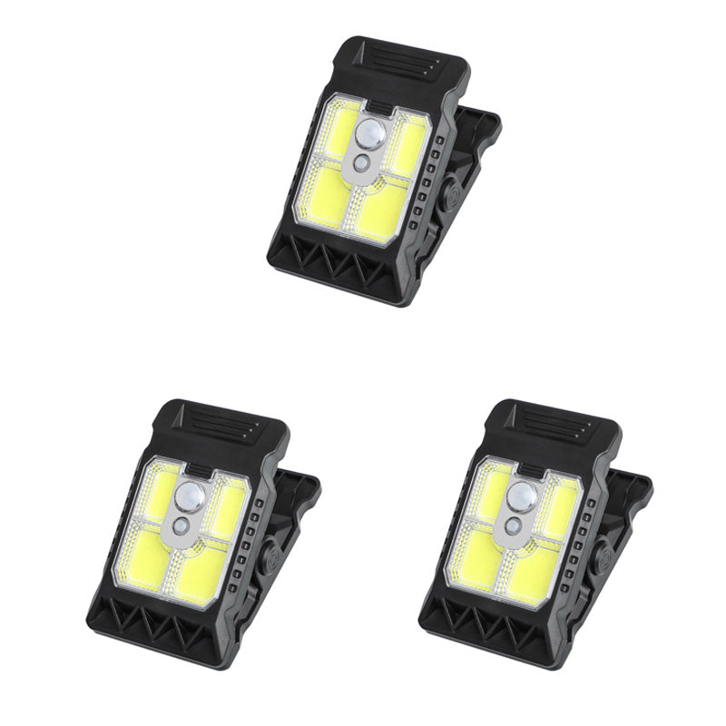 Outdoor solar-powered light with clip and motion sensor