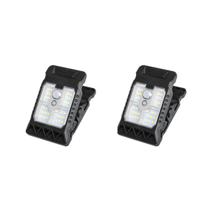 Outdoor solar-powered light with clip and motion sensor